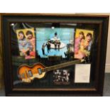 Beatles Display containing Bass Guitar (strung right handed) and images of the Beatles 54x45'',