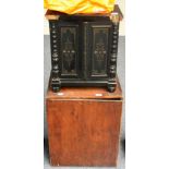 Organette hand cranked with 24 stop organ in black lacquered wooden cabinet with carved decoration