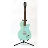 Danelectro Guitar no. 010967 Made in Korea, in aqua blue with matching scratchplate, twin single