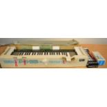 Yamaha PS-55 Portatone Keyboard in original box with EP-1 Expression Pedal; together with an M-