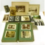 A Distressed Postcard Album, part filled. Includes social history, real photographic, etc; with a