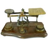 A Set of Victorian Inland Postal Rate Scales, brass with mahogany base