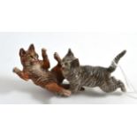 A cold painted bronze of two cats fighting