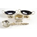 A Victorian silver gospel straining spoon, pair of silver salts with blue glass liners and another