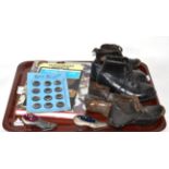 Pair of child's black leather lace up boots, two pairs of clogs, two shoe pin cushion, two books and