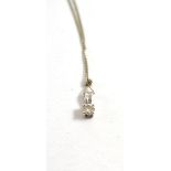 A 9ct white gold diamond solitaire pendant on chain, 0.15 carat approximately