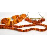 A Russian silver gilt amber necklace and two amber bead necklaces (3)