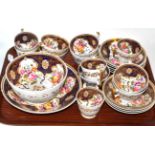 A collection of 19th century tea wares decorated with floral sprays and highlighted in gilt