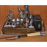 A collection of silver and silver plate including a pair of silver toast racks, sugar caster,