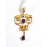 An amethyst set floral pendant