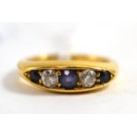 An 18ct gold old cut diamond and sapphire ring