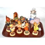 Seven Hummel pottery figures and a Nao china figure (8)