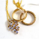 A 9ct gold tanzanite and diamond necklace, a 9ct gold band ring and an eternity ring (3)