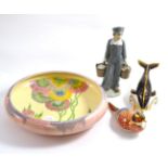 Clarice Cliff pottery bowl; two Royal Crown Derby china paperweights and a Lladro china figure (4)