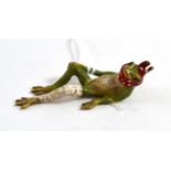 A cold painted bronze of an injured frog