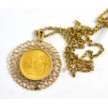 An Elizabeth II Isle of Man 1973 gold sovereign, loose mount in fancy frame and chain