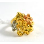 An 18ct yellow, rose and white gold ring