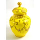 A Royal Crown Derby jar and cover with a yellow ground