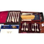 Six cased silver sets including enamelled crown tooth picks with silver backed brush and comb (qty)