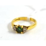 An 18ct gold emerald and diamond ring