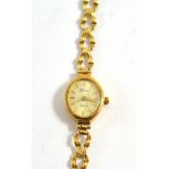 A Geneve 'Gold' 9ct gold cased quartz wristwatch, on 9ct gold bracelet