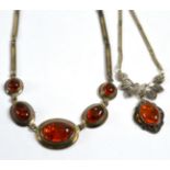 An amber fire stone necklace and an amber and marcasite necklace (2)