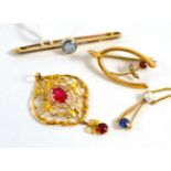 A group of early 20th century jewellery including a bar brooch, a pendant, a brooch and a necklace