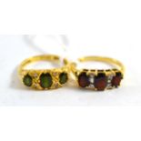 An 18ct gold green stone and diamond ring, and an 18ct gold garnet and diamond ring (2)