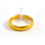 A 22ct gold band ring