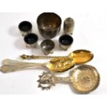 A Victorian silver gilt Mr Pickwick fruit spoon, a pair of berry spoons, a Dutch fancy spoon, a late