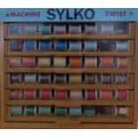 Circa 1950s Dewhursts Sylko Machine Twist Advertising Table Top Display Cabinet, of six drawers,