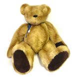 A Very Large Jointed Hartley Bear's Emporium Teddy Bear in light tan plush, dark tan suede paw pads,