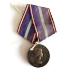 A Royal Victorian Medal, un-named, with ribbon for a foreign recipient