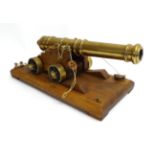 A Good Quality Brass Model of a Signal Cannon, the 32cm five ringed brass barrel with swollen muzzle