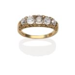 An 18 Carat Gold Diamond Five Stone Ring, the graduated old cut diamonds in yellow carved settings