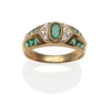 An Emerald and Diamond Ring, an oval cut emerald in a yellow rubbed over setting, flanked by pavé