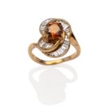 A Diamond Cluster Ring, a round brilliant cut cognac coloured diamond in a yellow four claw