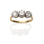 An 18 Carat Gold Diamond Three Stone Ring, three round brilliant cut diamonds in white claw settings