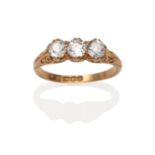 An 18 Carat Gold Diamond Three Stone Ring, three old cut diamonds in yellow claw settings, to a