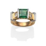 An Emerald and Diamond Ring, an emerald-cut emerald in a white half rubbed over setting, flanked