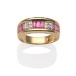 A Ruby and Diamond Ring, groups of baguette cut rubies in yellow channel settings, spaced by white