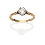 A Diamond Solitaire Ring, an old cut diamond in a white double six claw setting, on a yellow plain