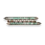 An Art Deco Emerald and Diamond Brooch, formed of two white parallel bars channel set with calibré