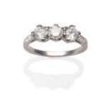 An 18 Carat White Gold Diamond Three Stone Ring, the round brilliant cut diamonds in white claw