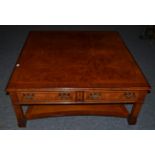 A Reproduction Burr Walnut Coffee Table, of large proportions, the crossbanded and featherbanded top
