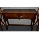 A Titchmarsh & Goodwin Oak Hall Table, with two frieze drawers above an arched apron, turned gun