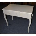 A Cream Painted Hall Table, of recent date, the moulded top above two frieze drawers and raised on