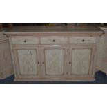 An Italian Style Cream Painted Sideboard, of recent date, with three frieze drawers above three