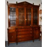 A Regency Style Mahogany and Ebony Strung Breakfront Bookcase, of recent date, the architectural