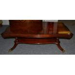 A Charles Barr Reproduction Mahogany Serpentine Shaped Coffee Table, with quarter veneered and